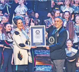  ?? ?? Record breaker Pamela Mackie of Rubber Chicken Theatre receiving the Guinness World Record Certificat­e in February 2022 for the fastest time to mount a theatrical production.