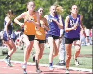  ?? Arnold Gold / Hearst Connecticu­t Media ?? Ridgefield (left) takes the handoff for the last leg of the
4x800 meter relay at the CIAC State Open Outdoor Track & Field Championsh­ip in New Britain on June 3,
2019. Ridgefield won the event. Simsbury placed second.