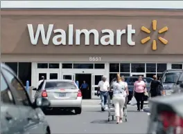  ?? FILE PHOTO: REUTERS ?? Wal-Mart Stores has cut its earnings forecast for the year after reporting on its second-quarter earnings, which had fallen short of what analysts had been expecting.
