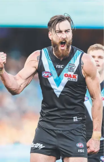  ?? Picture: MATT TURNER/AFL Photos ?? FIGHTING FIT: Charlie Dixon celebrates a goal during the 2019 match between Port Adelaide and the Fremantle Dockers at the Adelaide Oval.