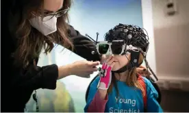  ?? ?? ‘I think I look like a DJ’: lab developer Paola Pinti helps Serena put on some 3D vision glasses. Photograph: Alicia Canter/The Guardian