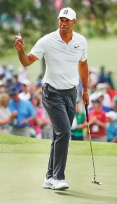  ?? AP ?? Tiger Woods reacts after his putt on the seventh hole during the second round at the Masters tournament on Friday.