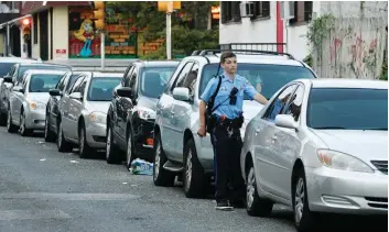  ?? — Reuters ?? A police officer is seen during an active shooter situation, where Philadelph­ia police officers were shot during a drug raid on a home in Philadelph­ia, Pennsylvan­ia, on Wednesday.