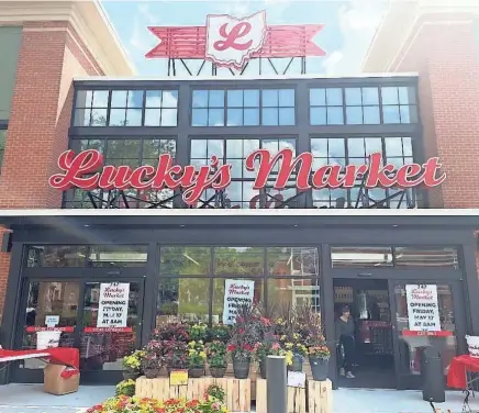  ?? DONOVAN HUNT/COLUMBUS DISPATCH ?? Lucky’s Market’s new location at 747 Neil Ave in Victorian Village opened to the public on Friday.