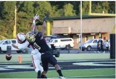  ?? The Sentinel-Record/Krishnan Collins ?? ■ Hot Springs wide receiver T.J. Brogdon (0) battles with Vilonia’s Eli Mosier (7) in the Trojans’ 47-39 win over the Eagles Aug. 26, 2022, at Joe C. Reese Stadium.