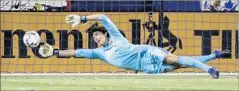  ?? Chris Carlson Associated Press ?? BRIAN ROWE of the Galaxy makes a second-half save against Philadelph­ia on Saturday night. L.A. outshot Philadelph­ia, 13-8.