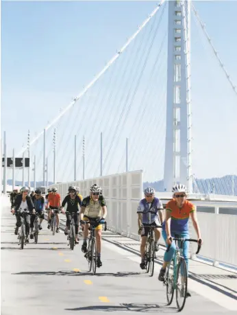  ?? Paul Chinn / The Chronicle 2017 ?? A group of bicyclists, including Oakland Mayor Libby Schaaf, approaches Yerba Buena Island on the Bay Bridge Bike Path last year.