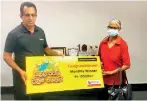  ?? ?? Seevali Illangasin­ghe (NDB Branch Manager – Kurunegala) hands over the cheque to Jepin Nona from Kegalle