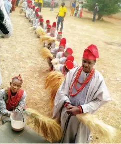  ??  ?? The age-grade waiting for prayer from the eldest man in the community. PHOTOS: Usman A. Bello