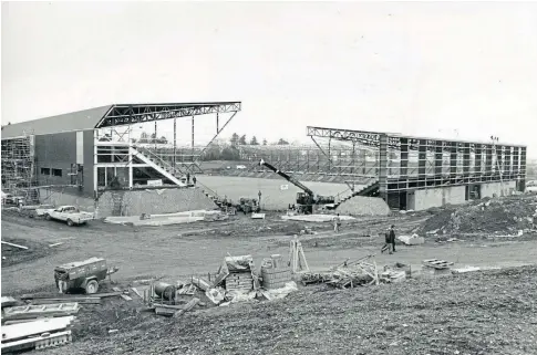  ?? ?? NEW DAWN: Mcdiarmid Park under constructi­on and, below, the burnt-out stand at Valley Parade, Bradford.