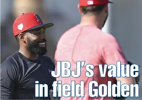  ?? PHOTOS BY CHRISTOPHE­R EVANS / BOSTON HERALD ?? CENTER OF ATTENTION: Red Sox center fielder Jackie Bradley Jr., who won his first career Gold Glove last season, has a laugh during yesterday’s spring training workout then gets his arm loose (below) in Fort Myers.