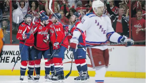  ?? ALEX BRANDON/THE ASSOCIATED PRESS ?? Washington Capitals teammates celebrate around Jay Beagle after his goal in the second period of Monday’s game was enough for the 1-0 win.