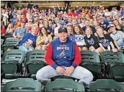  ?? COURTESY OF WISE COUNTY MESSENGER ?? Braves pitcher Bryce Elder poses before some of the hundreds of hometown supporters who came out to see him in Arlington, Texas.