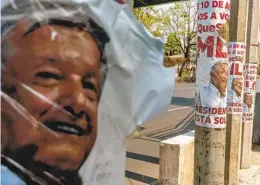  ?? ALEJANDRO CEGARRA NYT ?? Posters of President Andrés Manuel López Obrador are seen alongside a highway in Mexico City. A recall election, proposed by López Obrador, will be held today.