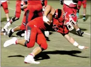  ?? MARK HUMPHREY ENTERPRISE-LEADER ?? Farmington senior tailback Caleb Williams puts a hand down while keeping his knee above the turf on a 5-yard run. Williams averaged 5.2-yards-per-carry and 101 yards a game with 14 touchdowns.