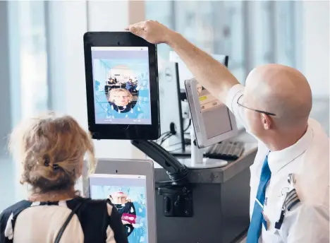  ?? RAY WHITEHOUSE/THE NEW YORK TIMES 2018 ?? A traveler undergoes a facial recognitio­n screening at Dulles Internatio­nal Airport in Dulles, Virginia.