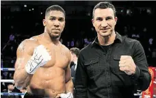  ?? Anthony Joshua (vlevo) a Vladimir Kličko. FOTO REUTERS ?? Boxerští šampioni.