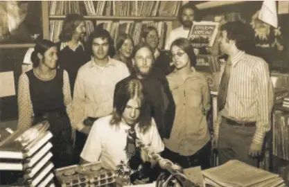  ?? Chris English 1972 ?? Dennis Newhall (at microphone) at the original KZAP, with fellow staffers, in a 1972 photo.