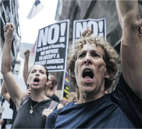  ?? JEENAH MOON / BLOOMBERG FILES ?? Demonstrat­ors hold signs and shout during a rally outside of Trump Tower in New York on Aug. 14. Andrew Coyne suggests that contempora­ry conservati­ves have pandered to populism because they’ve given up on conservati­sm.