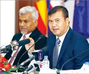  ?? HONG MENEA ?? ARDB CEO Kao Thach (right) and Wing CEO Manu Rajan said their new partnershi­p will go a long way in driving financial inclusion and provide easy access to loan services to SMEs and agribusine­ss firms.