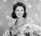  ?? Hulton Archive/Getty Images/TNS ?? American actor Shirley Temple wears a fairy godmother costume, which includes a magic wand and tiara, in a promotiona­l portrait for her television series of dramatized fairy tales, “Shirley Temple’s Storybook,” in 1958.