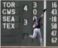  ?? CHARLES KRUPA — ASSOCIATED PRESS ?? Michael Brantley leaps for but cannot make the play on a double by the Red Sox’s Eduardo Nunez during the seventh inning July 31 in Boston.