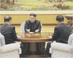  ??  ?? 0 North Korean leader Kim Jong Un with senior aides yesterday
