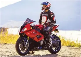  ?? DEON NEL/Special to The Okanagan Weekend ?? Jason Lotoski of Kelowna’s Tonit Media Solutions, pictured here on his 2015 BMW S1000RR, has created the Tonit Motorcycle Community app.