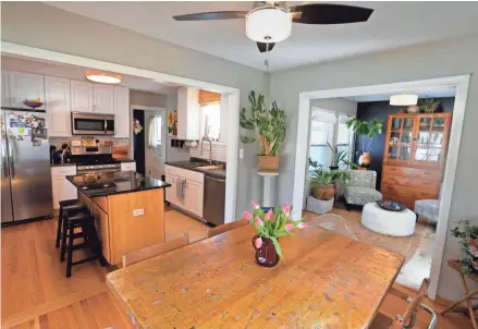  ?? PHOTOS BY RICK WOOD/JOURNAL SENTINEL ?? The Ziemans have an open-concept plan for the dining room, kitchen and sun room.