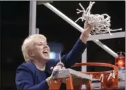 ?? PAT LITTLE — THE ASSOCIATED PRESS FILE ?? In this file photo Penn State women’s basketball coach Rene Portland waves the net she cut down to celebrate their Big 10 regular season championsh­ip after defeating Wisconsin in State College, Pa. Portland, who built Penn State into a women’s...