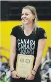  ?? SUPPLIED ?? Pro basketball player Lizanne Murphy receiving an Excellence Award at Sun Youth’s bike giveaway in June 2017.