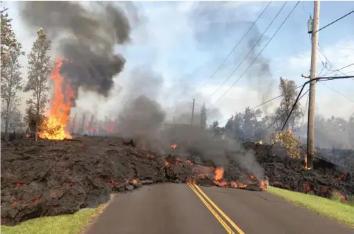  ?? U. S. GEOLOGICAL SURVEY VIA AP ?? Lava from a fissure slowly advances to the northeast on Hookapu Street in the Leilani Estates subdivisio­n in Pahoa, Hawaii, Saturday.