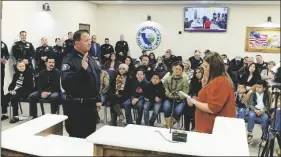  ?? PHOTO COURTESY CITY OF IMPERIAL ?? New Interim Chief of Police for the City of Imperial, Michael Crankshaw (left), takes an oath of office as sworn in by city clerk Kristina Shields (right), during an Imperial City Council meeting, Wednesday, March 1, in Imperial.