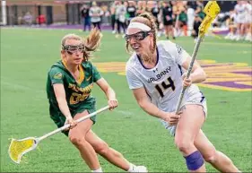  ?? James Franco / Special to the Times Union ?? UAlbany senior and Guilderlan­d graduate Kadi Futia makes a move in front of Vermont sophomore Brittany Barton in the title game Saturday.