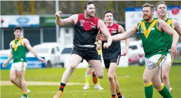  ?? ?? Jed Lamb leaps into the air to celebrate as he kicks a goal for Warragul.