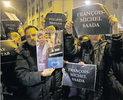  ??  ?? Members of the Union of French Jewish students hold posters with the first names of the victims during a demonstrat­ion outside a kosher grocery store where four hostages were killed.
