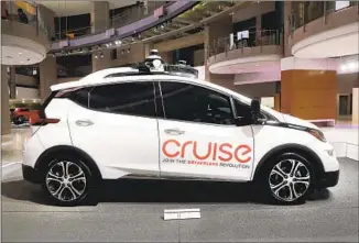  ?? Paul Sancya Associated Press ?? THE CRUISE AV, General Motors’ autonomous electric vehicle, is displayed in Detroit in January. The challenge now facing self-driving car makers is to gain government approval and public trust.