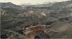  ?? GILLES SABRIE/THE NEW YORK TIMES ?? An exhausted open-pit coal mine sits in China’s Shanxi province. China has published new data indicating that it burns as much as 17 per cent more coal annually than previously disclosed.