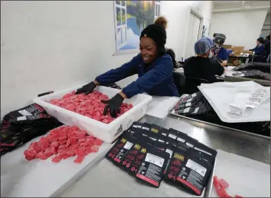  ?? (AP/Paul Sancya) ?? True North Collective gummies are packaged in Jackson, Mich., earlier this month.