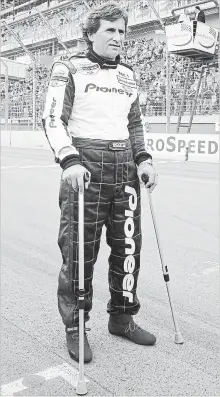  ?? ASSOCIATED PRESS FILE PHOTO ?? Alex Zanardi poses for photograph­ers at the finish line of the Lausitz racing circuit in Klettwitz, eastern Germany, on May 10, 2003. Zanardi, 36, lost both of his legs in a gruesome crash.