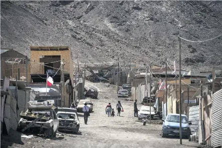  ?? MARTIN BERNETTI/AFP/GETTY IMAGES ?? View of Los Arenales neighbourh­ood in northern Chile. Chile’s income relies heavily on copper exports, but the country hopes to leverage mineral extraction into economic diversity.