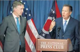  ?? Mark Wilson Getty Images ?? COLORADO GOV. John Hickenloop­er, left, and Ohio Gov. John Kasich criticize the Senate’s healthcare proposal, which would make deep cuts to Medicaid.