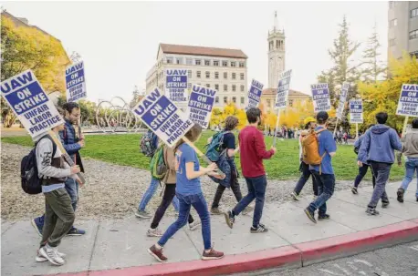  ?? Salgu Wissmath/The Chronicle ?? Student researcher­s and instructor­s picket at UC Berkeley on Wednesday as part of a strike by workers across the UC system.