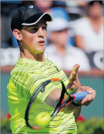  ?? — THE ASSOCIATED PRESS ?? Vasek Pospisil of Vancouver returns a shot to Andy Murray during their match at the BNP Paribas Open on Saturday in Indian Wells, Calif.