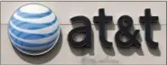 ?? STEVEN SENNE — THE ASSOCIATED PRESS ?? This May 14, 2014, photo shows an AT&T logo on a store in Dedham, Mass.