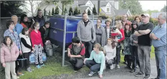  ??  ?? Glencormac Lower residents collecting water at a provided bowser. The residents have been without water since last Wednesday, with no notice given from the council or water services.