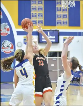  ?? Staff photo/Jake Dowling ?? Minster’s Ella Mescher (23) attempts a contested shot against St. Marys’ Elena Menker (4) and Kiley Tennant (21) during the second half of Tuesday’s non-league girls basketball game.