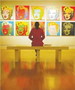  ?? BEN STANSALL/AFP/GETTY IMAGES ?? Andy Warhol’s silkscreen prints of Marilyn Monroe were among the works that launched him into the mainstream.