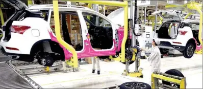  ?? PROVIDED TO CHINA DAILY ?? Workers assemble a GS8, a homegrown SUV, at the production base of GAC Group in Guangzhou, Guangdong province.