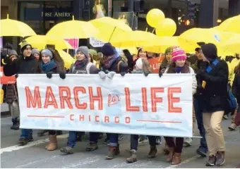  ?? JON SEIDEL/ SUN- TIMES ?? Anti- abortion demonstrat­ors participat­e in the March for Life walk in 2016.